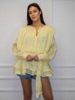 Kollane pikendatud volangpluus